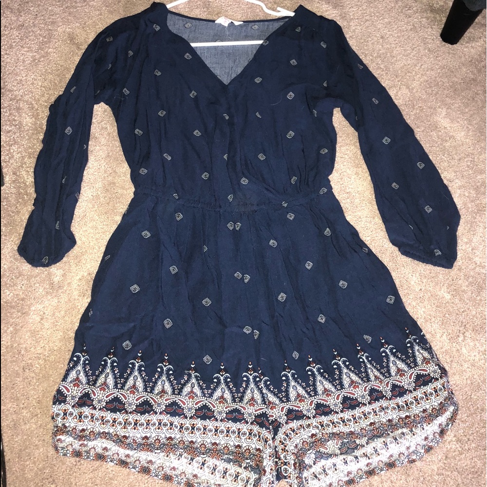 A navy blue romper with colorful accents!